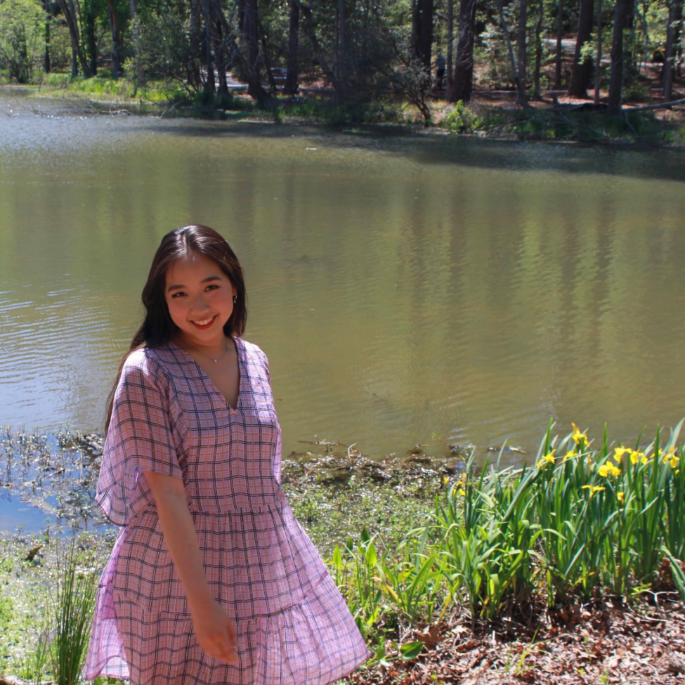 picture of an asian woman, Erin Lee, in front of a pond